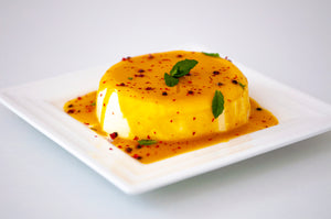 Panna cotta with mango and pink pepper
